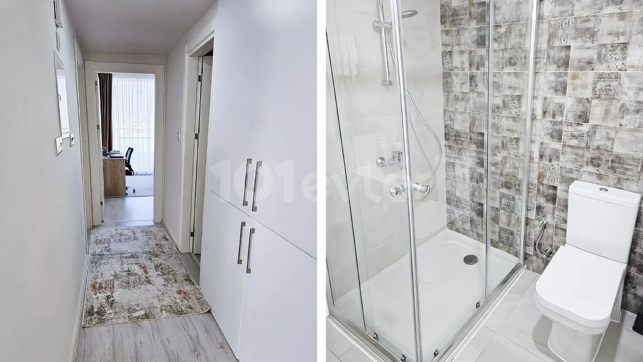 Apartment hallway and bathroom with a glass shower enclosure